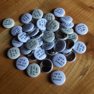 amid the old wounds - handstamped button